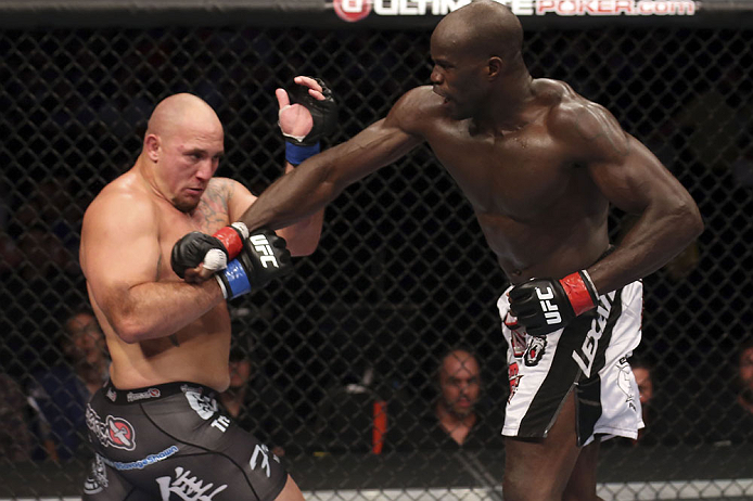 CALGARY, CANADA - JULY 21: (R-L) Cheick Kongo lands a punch to the chest of Shawn Jordan during their heavyweight bout at UFC 149 inside the Scotiabank Saddledome on July 21, 2012 in Calgary, Alberta, Canada. (Photo by Nick Laham/Zuffa LLC/Zuffa LLC via