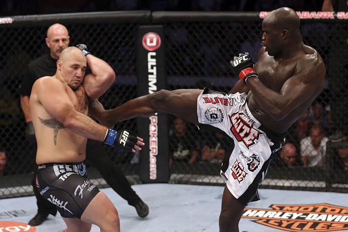 CALGARY, CANADA - JULY 21: (R-L) Cheick Kongo lands a kick to the body of Shawn Jordan during their heavyweight bout at UFC 149 inside the Scotiabank Saddledome on July 21, 2012 in Calgary, Alberta, Canada. (Photo by Nick Laham/Zuffa LLC/Zuffa LLC via Ge