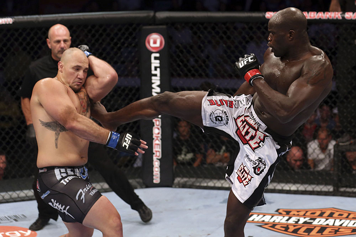 CALGARY, CANADA - JULY 21: (R-L) Cheick Kongo lands a kick to the body of Shawn Jordan during their heavyweight bout at UFC 149 inside the Scotiabank Saddledome on July 21, 2012 in Calgary, Alberta, Canada.  (Photo by Nick Laham/Zuffa LLC/Zuffa LLC via Ge