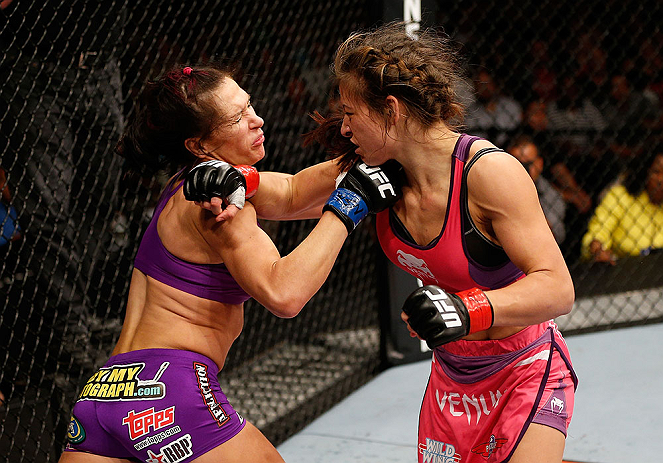 LAS VEGAS, NV - APRIL 13: (R-L) Miesha Tate punches Cat Zingano in their bantamweight fight at the Mandalay Bay Events Center on April 13, 2013 in Las Vegas, Nevada. (Photo by Josh Hedges/Zuffa LLC/Zuffa LLC via Getty Images) *** Local Caption *** Mi