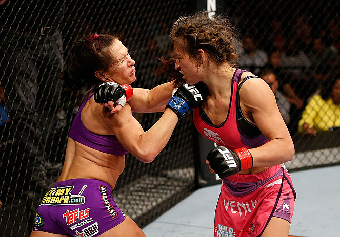 LAS VEGAS, NV - APRIL 13:   (R-L) Miesha Tate punches Cat Zingano in their bantamweight fight at the Mandalay Bay Events Center  on April 13, 2013 in Las Vegas, Nevada.  (Photo by Josh Hedges/Zuffa LLC/Zuffa LLC via Getty Images)  *** Local Caption *** Mi