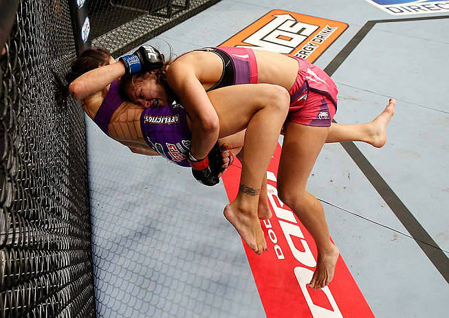 LAS VEGAS, NV - APRIL 13: Miesha Tate (top) takes down Cat Zingano in their bantamweight fight at the Mandalay Bay Events Center on April 13, 2013 in Las Vegas, Nevada. (Photo by Josh Hedges/Zuffa LLC/Zuffa LLC via Getty Images) *** Local Caption ***