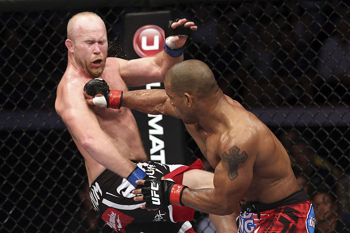 CALGARY, CANADA - JULY 21: (R-L) Hector Lombard lands a punch to the face of Tim Boetsch during their middleweight bout at UFC 149 inside the Scotiabank Saddledome on July 21, 2012 in Calgary, Alberta, Canada.  (Photo by Nick Laham/Zuffa LLC/Zuffa LLC via