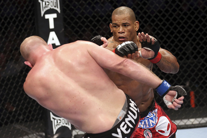 CALGARY, CANADA - JULY 21: (R-L) Hector Lombard throws a punch at Tim Boetsch during their middleweight bout at UFC 149 inside the Scotiabank Saddledome on July 21, 2012 in Calgary, Alberta, Canada. (Photo by Nick Laham/Zuffa LLC/Zuffa LLC via Getty Imag