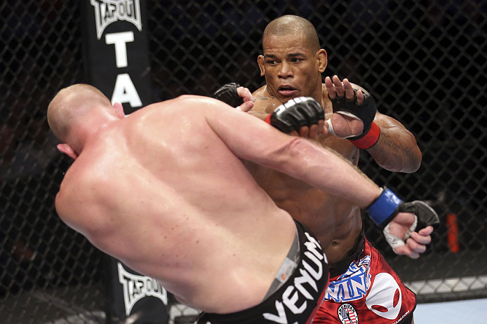 CALGARY, CANADA - JULY 21: (R-L) Hector Lombard throws a punch at Tim Boetsch during their middleweight bout at UFC 149 inside the Scotiabank Saddledome on July 21, 2012 in Calgary, Alberta, Canada.  (Photo by Nick Laham/Zuffa LLC/Zuffa LLC via Getty Imag