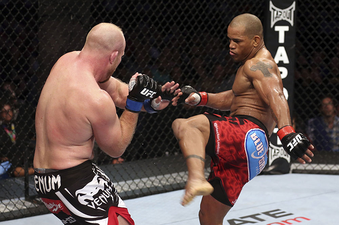CALGARY, CANADA - JULY 21: (R-L) Hector Lombard kicks at Tim Boetsch during their middleweight bout at UFC 149 inside the Scotiabank Saddledome on July 21, 2012 in Calgary, Alberta, Canada. (Photo by Nick Laham/Zuffa LLC/Zuffa LLC via Getty Images)