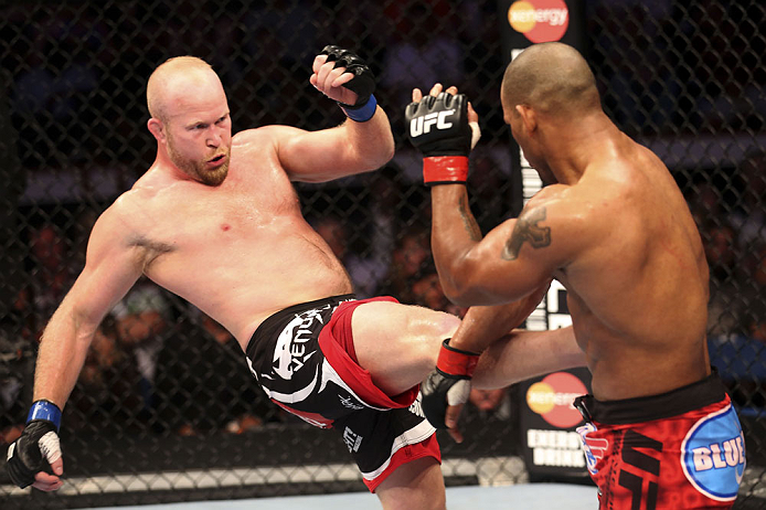 CALGARY, CANADA - JULY 21: (L-R) Tim Boetsch lands a kick to the body of Hector Lombard during their middleweight bout at UFC 149 inside the Scotiabank Saddledome on July 21, 2012 in Calgary, Alberta, Canada. (Photo by Nick Laham/Zuffa LLC/Zuffa LLC via