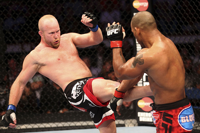 CALGARY, CANADA - JULY 21: (L-R) Tim Boetsch lands a kick to the body of Hector Lombard during their middleweight bout at UFC 149 inside the Scotiabank Saddledome on July 21, 2012 in Calgary, Alberta, Canada.  (Photo by Nick Laham/Zuffa LLC/Zuffa LLC via 