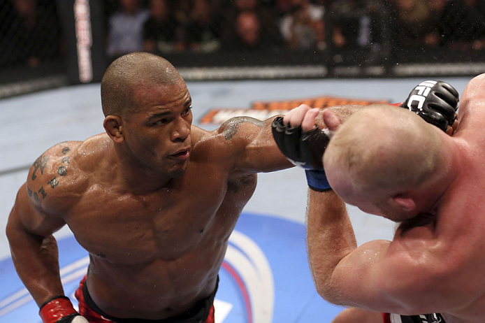 CALGARY, CANADA - JULY 21: (L-R) Hector Lombard throws a punch at Tim Boetsch during their middleweight bout at UFC 149 inside the Scotiabank Saddledome on July 21, 2012 in Calgary, Alberta, Canada.  (Photo by Nick Laham/Zuffa LLC/Zuffa LLC via Getty Imag