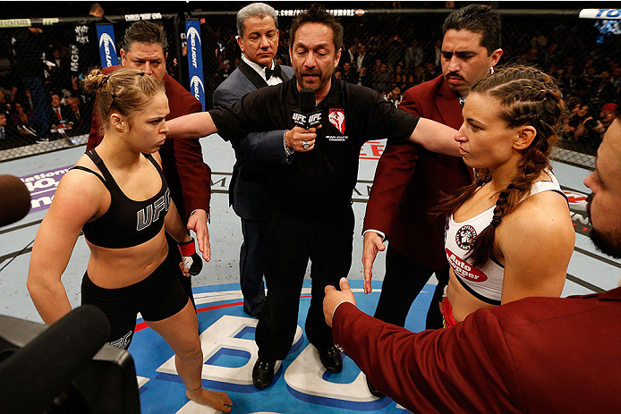 LAS VEGAS, NV - DECEMBER 28:  Ronda Rousey (left) and Miesha Tate (right) face off before their UFC women's bantamweight championship bout during the UFC 168 event at the MGM Grand Garden Arena on December 28, 2013 in Las Vegas, Nevada. (Photo by Josh Hed