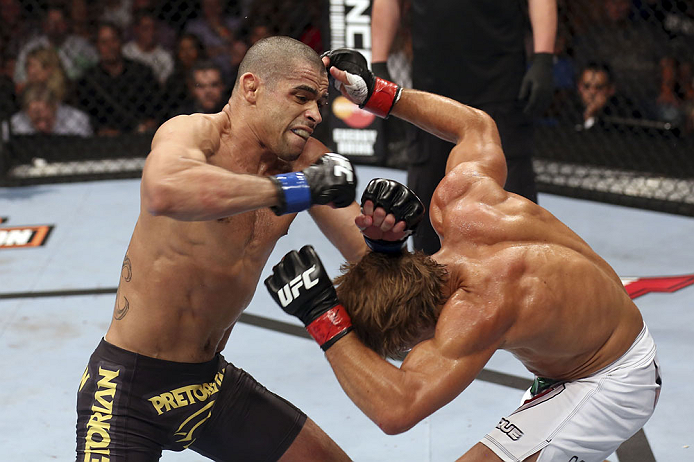 CALGARY, CANADA - JULY 21: (L-R) Renan Barao throws a punch at Urijah Faber during their UFC interim bantamweight championship bout at UFC 149 inside the Scotiabank Saddledome on July 21, 2012 in Calgary, Alberta, Canada. (Photo by Nick Laham/Zuffa LLC/Z
