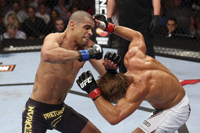 CALGARY, CANADA - JULY 21: (L-R) Renan Barao throws a punch at Urijah Faber during their UFC interim bantamweight championship bout at UFC 149 inside the Scotiabank Saddledome on July 21, 2012 in Calgary, Alberta, Canada.  (Photo by Nick Laham/Zuffa LLC/Z