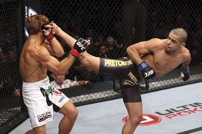 CALGARY, CANADA - JULY 21: (L-R) Urijah Faber blocks a kick from Renan Barao during their UFC interim bantamweight championship bout at UFC 149 inside the Scotiabank Saddledome on July 21, 2012 in Calgary, Alberta, Canada. (Photo by Nick Laham/Zuffa LLC/