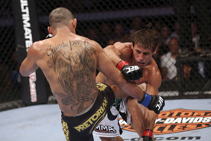 CALGARY, CANADA - JULY 21: (R-L) Urijah Faber throws a punch at Renan Barao during their UFC interim bantamweight championship bout at UFC 149 inside the Scotiabank Saddledome on July 21, 2012 in Calgary, Alberta, Canada. (Photo by Nick Laham/Zuffa LLC/