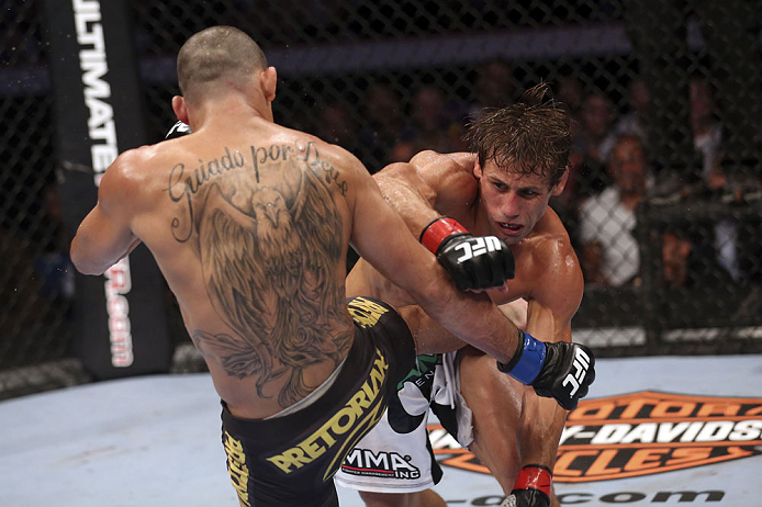 CALGARY, CANADA - JULY 21: (R-L)  Urijah Faber throws a punch at Renan Barao during their UFC interim bantamweight championship bout at UFC 149 inside the Scotiabank Saddledome on July 21, 2012 in Calgary, Alberta, Canada.  (Photo by Nick Laham/Zuffa LLC/