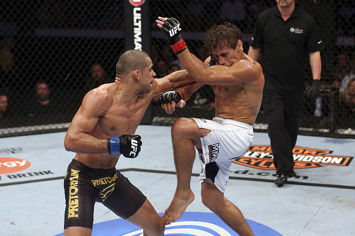 CALGARY, CANADA - JULY 21: (L-R) Renan Barao lands a punch to Urijah Faber during their UFC interim bantamweight championship bout at UFC 149 inside the Scotiabank Saddledome on July 21, 2012 in Calgary, Alberta, Canada. (Photo by Nick Laham/Zuffa LLC/Zu