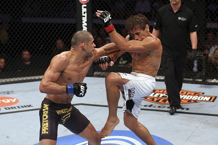 CALGARY, CANADA - JULY 21: (L-R) Renan Barao lands a punch to Urijah Faber during their UFC interim bantamweight championship bout at UFC 149 inside the Scotiabank Saddledome on July 21, 2012 in Calgary, Alberta, Canada.  (Photo by Nick Laham/Zuffa LLC/Zu