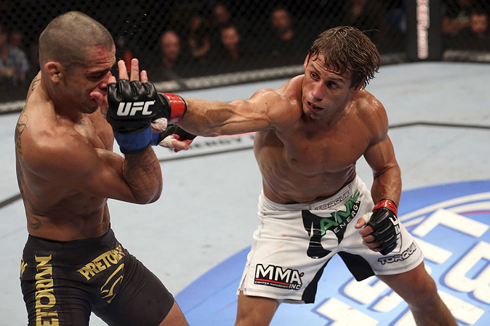 CALGARY, CANADA - JULY 21: (R-L) Urijah Faber throws a punch at Renan Barao during their UFC interim bantamweight championship bout at UFC 149 inside the Scotiabank Saddledome on July 21, 2012 in Calgary, Alberta, Canada. (Photo by Nick Laham/Zuffa LLC/Z