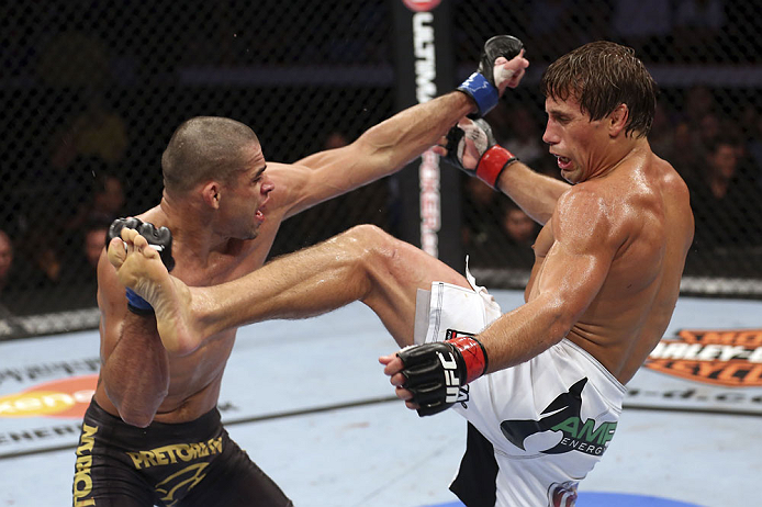 CALGARY, CANADA - JULY 21: (L-R) Renan Barao blocks a kick from Urijah Faber during their UFC interim bantamweight championship bout at UFC 149 inside the Scotiabank Saddledome on July 21, 2012 in Calgary, Alberta, Canada. (Photo by Nick Laham/Zuffa LLC/