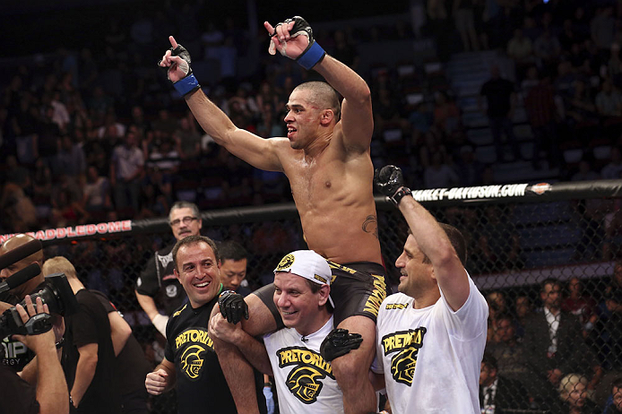 CALGARY, CANADA - JULY 21: Renan Barao celebrates his victory over Urijah Faber after their UFC interim bantamweight championship bout at UFC 149 inside the Scotiabank Saddledome on July 21, 2012 in Calgary, Alberta, Canada. (Photo by Nick Laham/Zuffa L