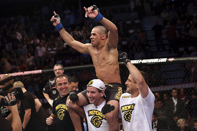 CALGARY, CANADA - JULY 21:  Renan Barao celebrates his victory over Urijah Faber after their UFC interim bantamweight championship bout at UFC 149 inside the Scotiabank Saddledome on July 21, 2012 in Calgary, Alberta, Canada.  (Photo by Nick Laham/Zuffa L