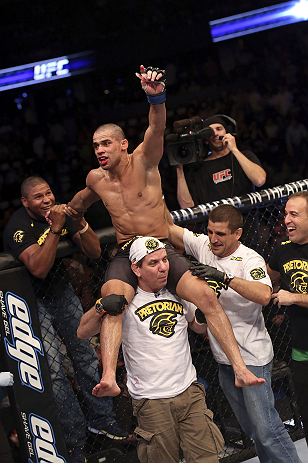 CALGARY, CANADA - JULY 21: Renan Barao celebrates with his team after his victory over Urijah Faber after their UFC interim bantamweight championship bout at UFC 149 inside the Scotiabank Saddledome on July 21, 2012 in Calgary, Alberta, Canada. (Photo b