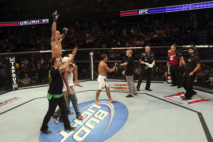 CALGARY, CANADA - JULY 21: Renan Barao celebrates his victory over Urijah Faber during their UFC interim bantamweight championship bout at UFC 149 inside the Scotiabank Saddledome on July 21, 2012 in Calgary, Alberta, Canada. (Photo by Nick Laham/Zuffa