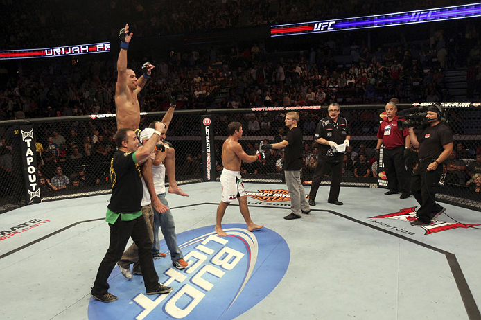 CALGARY, CANADA - JULY 21:  Renan Barao celebrates his victory over Urijah Faber during their UFC interim bantamweight championship bout at UFC 149 inside the Scotiabank Saddledome on July 21, 2012 in Calgary, Alberta, Canada.  (Photo by Nick Laham/Zuffa 