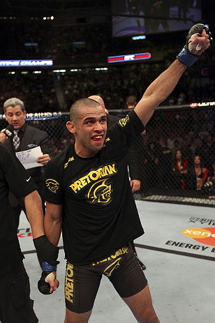 CALGARY, CANADA - JULY 21:  Renan Barao celebrates his victory over Urijah Faber during their UFC interim bantamweight championship bout at UFC 149 inside the Scotiabank Saddledome on July 21, 2012 in Calgary, Alberta, Canada.  (Photo by Nick Laham/Zuffa 