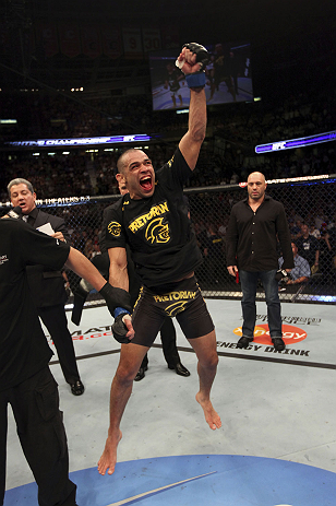 CALGARY, CANADA - JULY 21: Renan Barao celebrates his victory over Urijah Faber during their UFC interim bantamweight championship bout at UFC 149 inside the Scotiabank Saddledome on July 21, 2012 in Calgary, Alberta, Canada. (Photo by Nick Laham/Zuffa