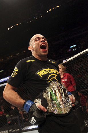 CALGARY, CANADA - JULY 21: Renan Barao celebrates his victory over Urijah Faber during their UFC interim bantamweight championship bout at UFC 149 inside the Scotiabank Saddledome on July 21, 2012 in Calgary, Alberta, Canada. (Photo by Nick Laham/Zuffa