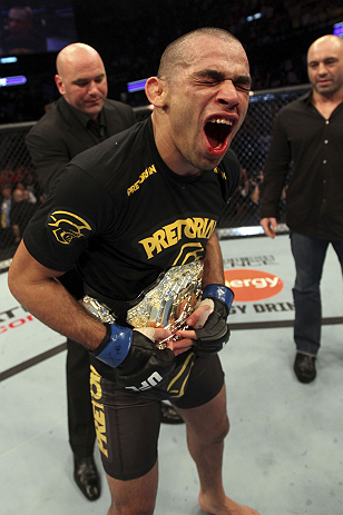 CALGARY, CANADA - JULY 21: Renan Barao celebrates his victory over Urijah Faber as UFC President Dana White gives him the Championship belt after their UFC interim bantamweight championship bout at UFC 149 inside the Scotiabank Saddledome on July 21, 201