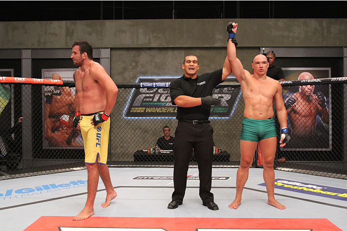SAO PAULO, BRAZIL - FEBRUARY 4: (R-L) Team Sonnen fighter Vitor Mirande celebrates after defeating Team Wanderlei fighter Antonio Branjao in their heavyweight fight during season three of The Ultimate Fighter Brazil on February 4, 2014 in Sao Paulo, Braz