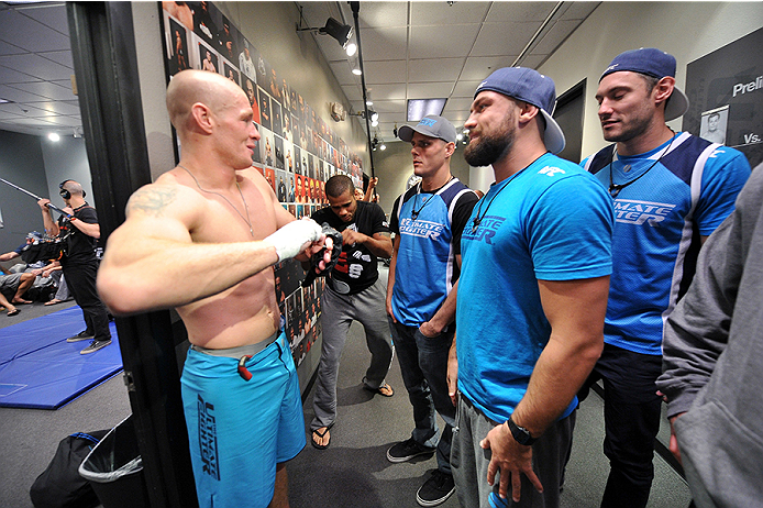 LAS VEGAS, NV - OCTOBER 29:  (L-R) Team Penn fighter Daniel Spohn celebrates with his team outside of the locker room after defeating Team Edgar fighter Todd Monaghan in their preliminary fight during filming of season nineteen of The Ultimate Fighter on 