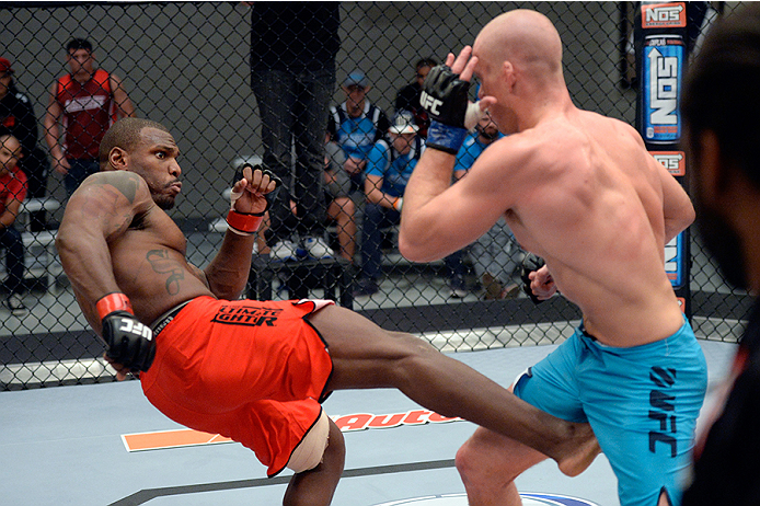 LAS VEGAS, NV - OCTOBER 29:  (L-R) Team Edgar fighter Todd Monaghan kicks Team Penn fighter Daniel Spohn in their preliminary fight during filming of season nineteen of The Ultimate Fighter on October 29, 2013 in Las Vegas, Nevada. (Photo by Jeff Bottari/