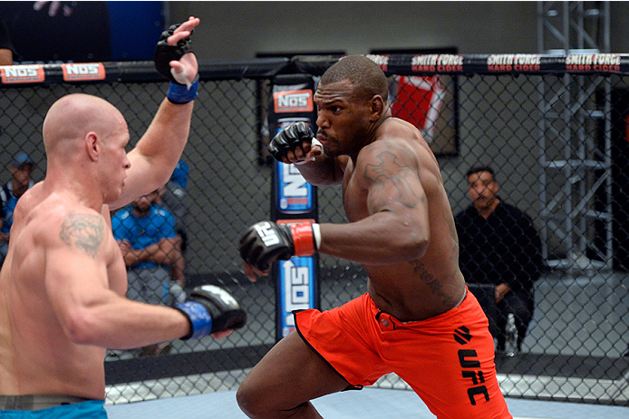 LAS VEGAS, NV - OCTOBER 29: (R-L) Team Edgar fighter Todd Monaghan punches Team Penn fighter Daniel Spohn in their preliminary fight during filming of season nineteen of The Ultimate Fighter on October 29, 2013 in Las Vegas, Nevada. (Photo by Jeff Bottar