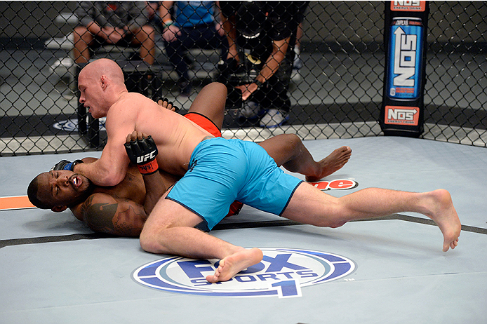 LAS VEGAS, NV - OCTOBER 29: (R-L) Team Penn fighter Daniel Spohn controls the body of Team Edgar fighter Todd Monaghan in their preliminary fight during filming of season nineteen of The Ultimate Fighter on October 29, 2013 in Las Vegas, Nevada. (Photo b