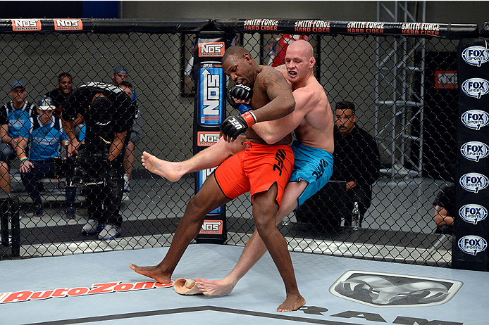 LAS VEGAS, NV - OCTOBER 29: (R-L) Team Penn fighter Daniel Spohn takes down Team Edgar fighter Todd Monaghan in their preliminary fight during filming of season nineteen of The Ultimate Fighter on October 29, 2013 in Las Vegas, Nevada. (Photo by Jeff Bot