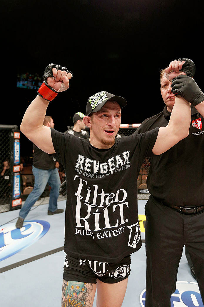 LAS VEGAS, NV - NOVEMBER 30:  Josh Sampo celebrates after submitting Ryan Benoit by rear naked choke in their flyweight fight during The Ultimate Fighter season 18 live finale inside the Mandalay Bay Events Center on November 30, 2013 in Las Vegas, Nevada