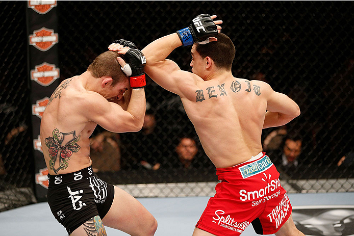 LAS VEGAS, NV - NOVEMBER 30:  (R-L) Ryan Benoit throws an elbow at Josh Sampo in their flyweight fight during The Ultimate Fighter season 18 live finale inside the Mandalay Bay Events Center on November 30, 2013 in Las Vegas, Nevada. (Photo by Josh Hedges