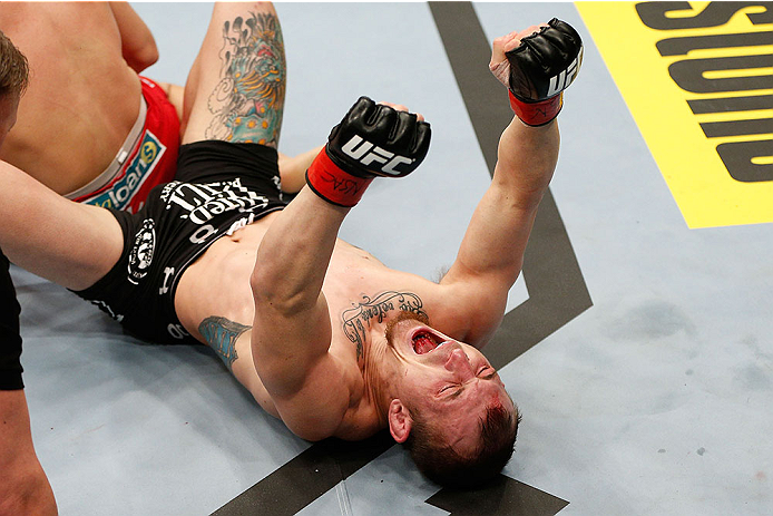 LAS VEGAS, NV - NOVEMBER 30:  Josh Sampo celebrates after submitting Ryan Benoit by rear naked choke in their flyweight fight during The Ultimate Fighter season 18 live finale inside the Mandalay Bay Events Center on November 30, 2013 in Las Vegas, Nevada