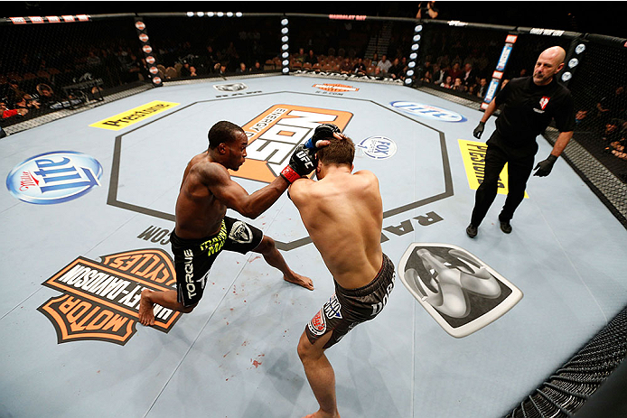 LAS VEGAS, NV - NOVEMBER 30: (L-R) Sean Spencer punches Drew Dober in their welterweight fight during The Ultimate Fighter season 18 live finale inside the Mandalay Bay Events Center on November 30, 2013 in Las Vegas, Nevada. (Photo by Josh Hedges/Zuffa
