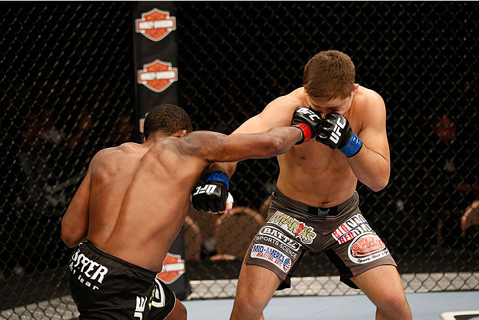 LAS VEGAS, NV - NOVEMBER 30: (L-R) Sean Spencer punches Drew Dober in their welterweight fight during The Ultimate Fighter season 18 live finale inside the Mandalay Bay Events Center on November 30, 2013 in Las Vegas, Nevada. (Photo by Josh Hedges/Zuffa