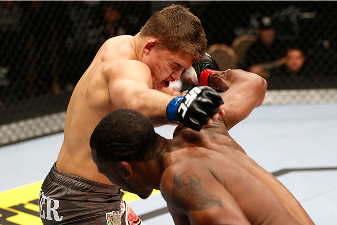 LAS VEGAS, NV - NOVEMBER 30:  (R-L) Sean Spencer punches Drew Dober in their welterweight fight during The Ultimate Fighter season 18 live finale inside the Mandalay Bay Events Center on November 30, 2013 in Las Vegas, Nevada. (Photo by Josh Hedges/Zuffa 