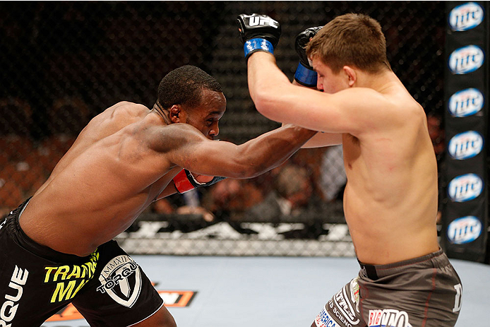 LAS VEGAS, NV - NOVEMBER 30: (L-R) Sean Spencer punches Drew Dober in their welterweight fight during The Ultimate Fighter season 18 live finale inside the Mandalay Bay Events Center on November 30, 2013 in Las Vegas, Nevada. (Photo by Josh Hedges/Zuffa