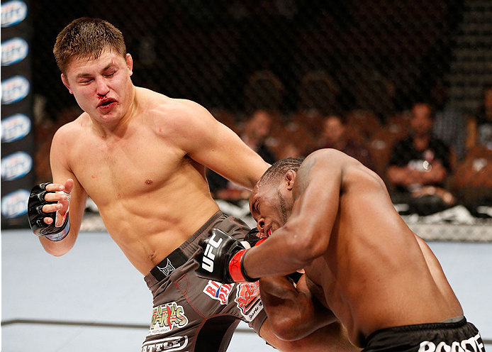 LAS VEGAS, NV - NOVEMBER 30:  (L-R) Drew Dober kicks Sean Spencer in their welterweight fight during The Ultimate Fighter season 18 live finale inside the Mandalay Bay Events Center on November 30, 2013 in Las Vegas, Nevada. (Photo by Josh Hedges/Zuffa LL