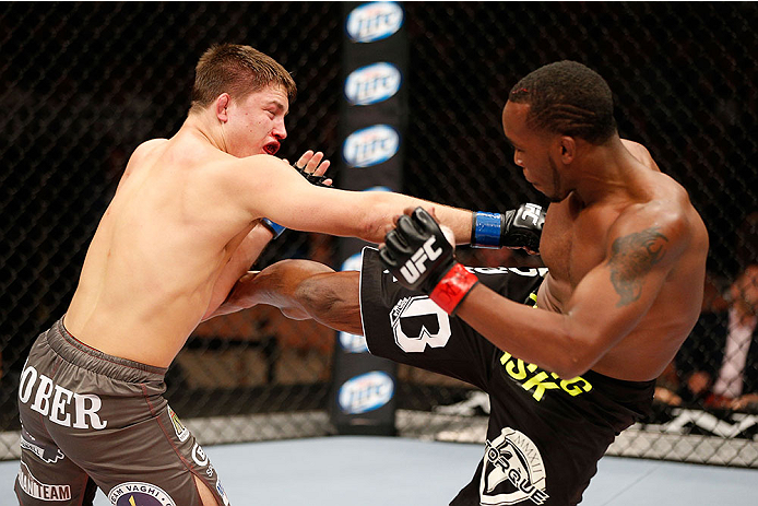 LAS VEGAS, NV - NOVEMBER 30:  (R-L) Sean Spencer kicks Drew Dober in their welterweight fight during The Ultimate Fighter season 18 live finale inside the Mandalay Bay Events Center on November 30, 2013 in Las Vegas, Nevada. (Photo by Josh Hedges/Zuffa LL