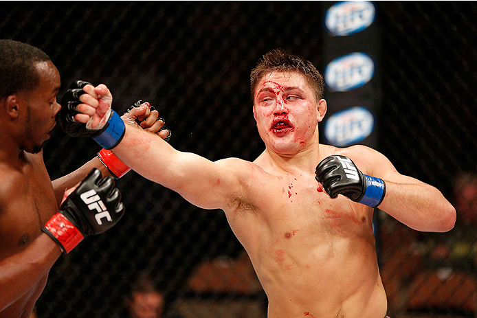 LAS VEGAS, NV - NOVEMBER 30:  (R-L) Drew Dober punches Sean Spencer in their welterweight fight during The Ultimate Fighter season 18 live finale inside the Mandalay Bay Events Center on November 30, 2013 in Las Vegas, Nevada. (Photo by Josh Hedges/Zuffa 