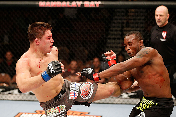 LAS VEGAS, NV - NOVEMBER 30:  (L-R) Drew Dober kicks Sean Spencer in their welterweight fight during The Ultimate Fighter season 18 live finale inside the Mandalay Bay Events Center on November 30, 2013 in Las Vegas, Nevada. (Photo by Josh Hedges/Zuffa LL