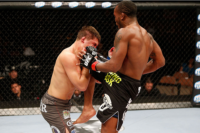 LAS VEGAS, NV - NOVEMBER 30: (R-L) Sean Spencer knees Drew Dober in their welterweight fight during The Ultimate Fighter season 18 live finale inside the Mandalay Bay Events Center on November 30, 2013 in Las Vegas, Nevada. (Photo by Josh Hedges/Zuffa LL